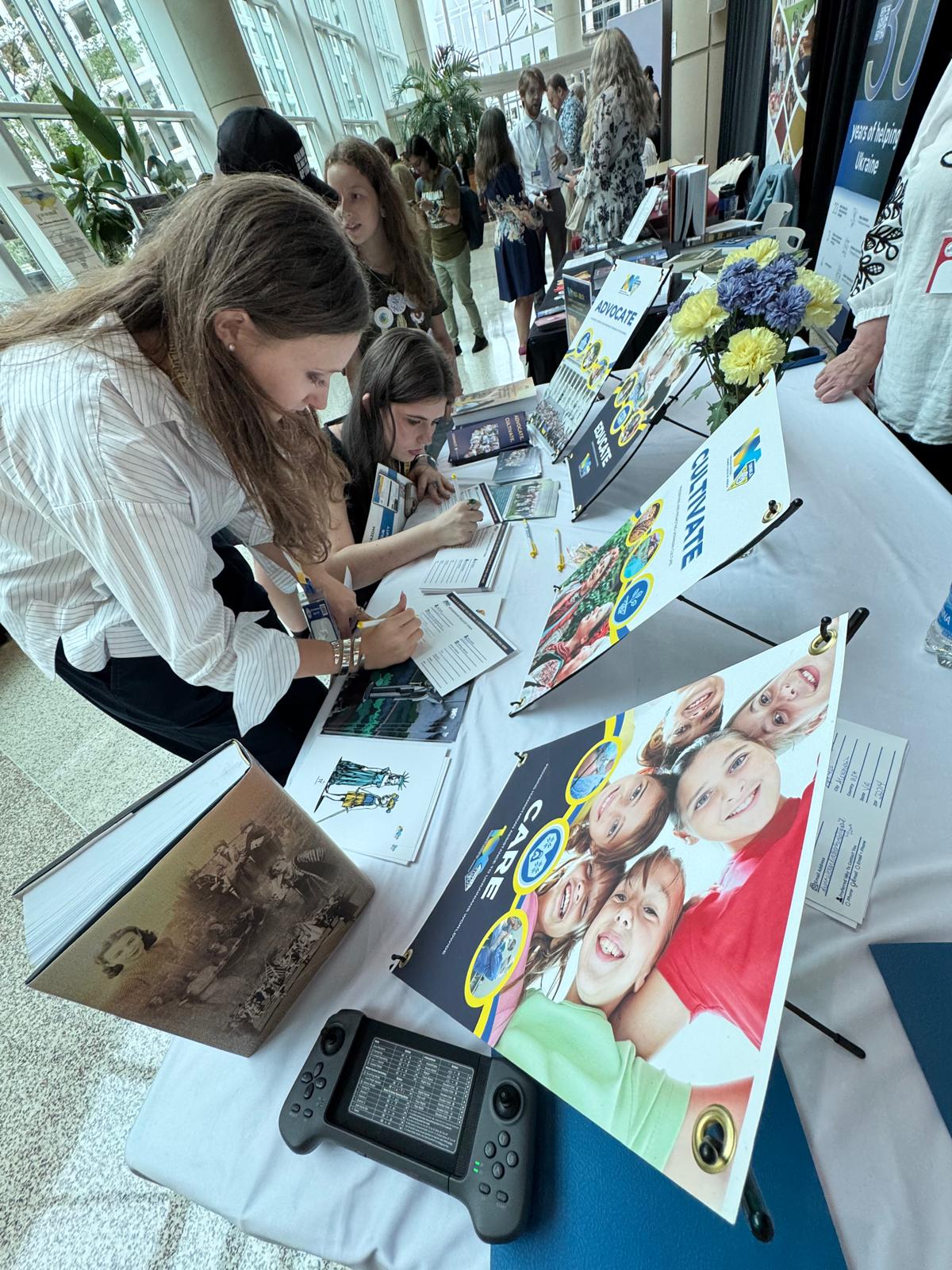 UNWLA at the Ukraine Action Summit, Fall 2026 6 | UNWLA - Ukrainian National Womens League of America Prospect members filling the UNWLA membership forms | UNWLA - Ukrainian National Womens League of America